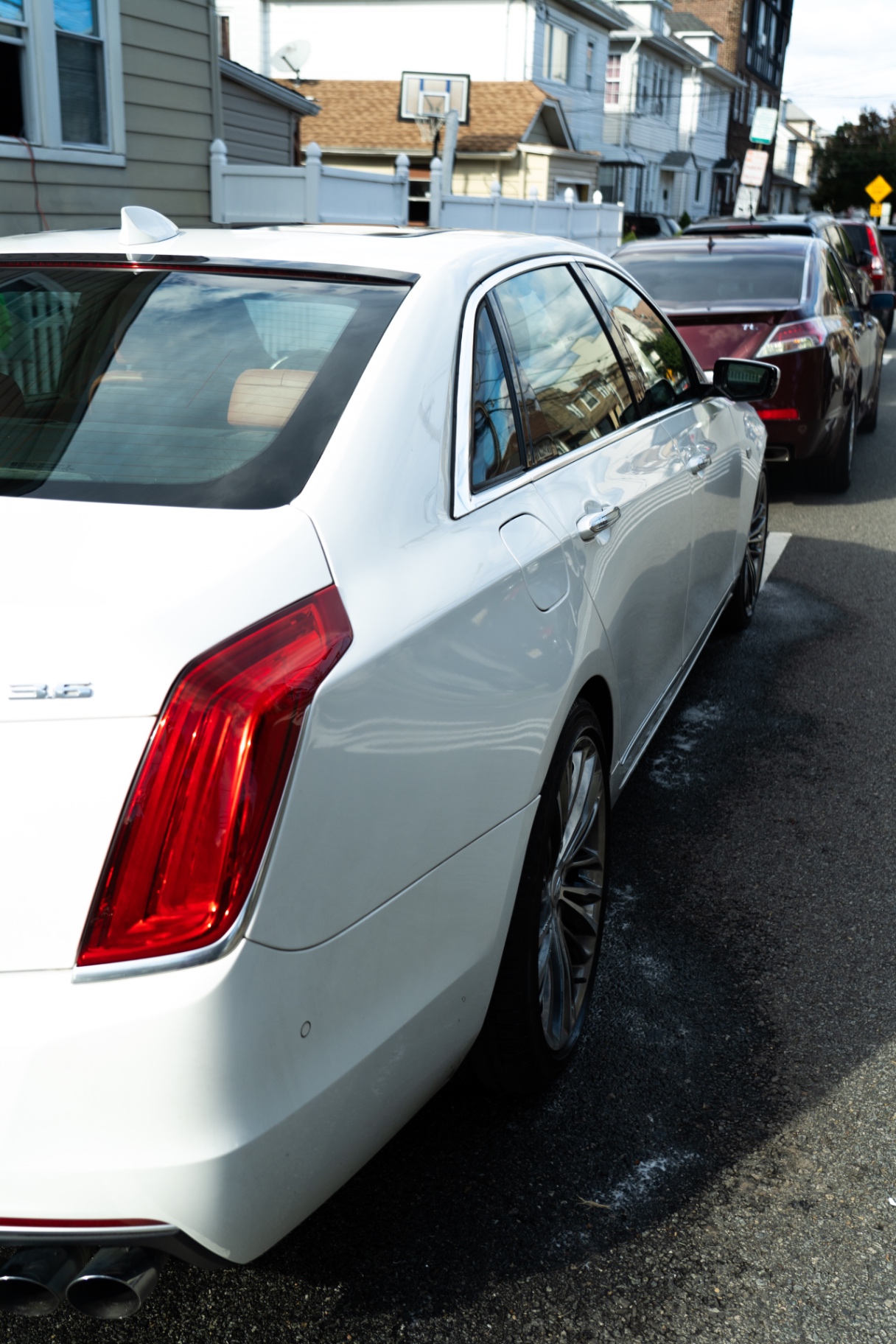 Glossy white Cadillac CT6 after an exterior detail